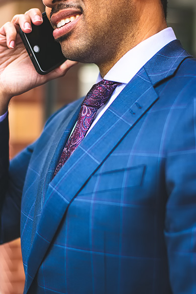 bluesuit_businessman_cellphone